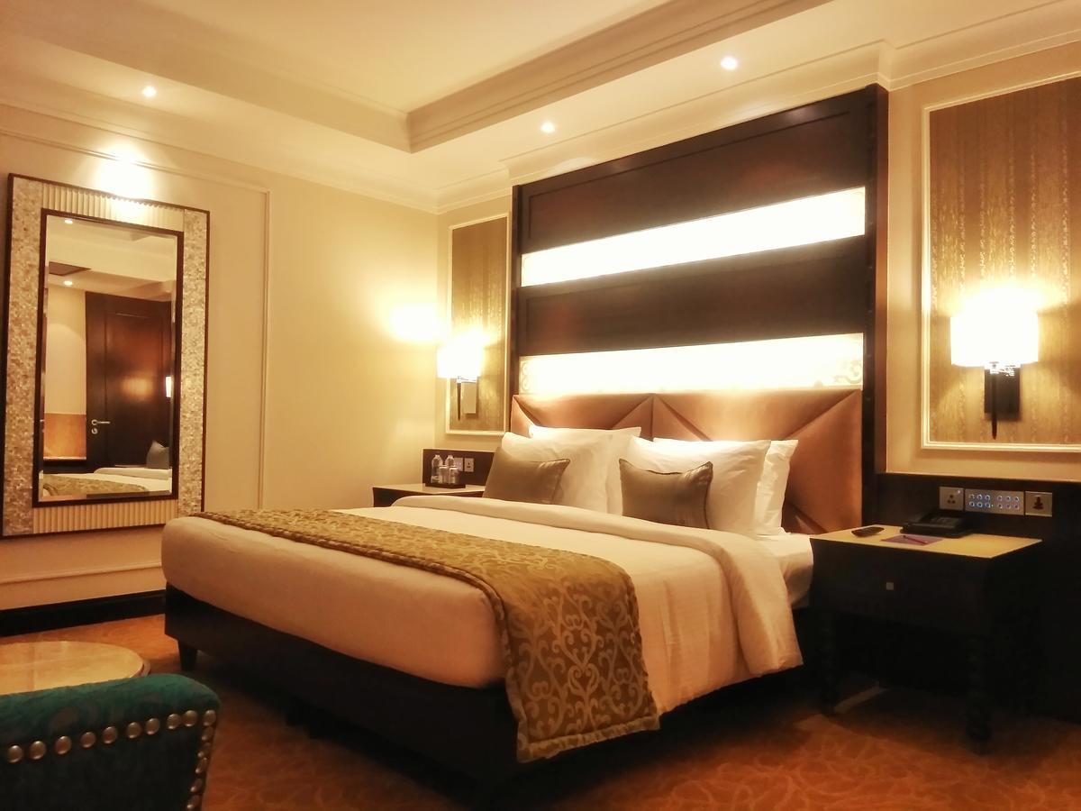 Ramada Plaza Chennai Hotel Exterior photo A bedroom at the Taj Bengal